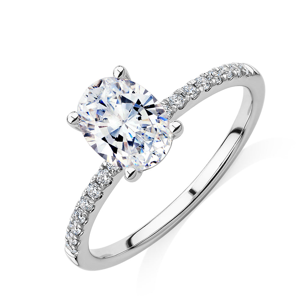 Oval and Round Brilliant shouldered engagement ring with 1.35 carats* of diamond simulants in 14 carat white gold