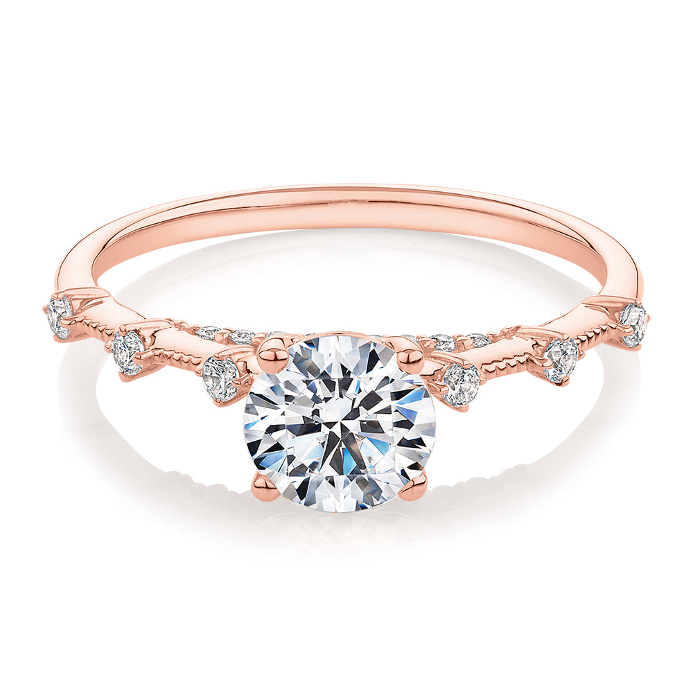 Round Brilliant shouldered engagement ring with 1.20 carats* of diamond simulants in 14 carat rose gold