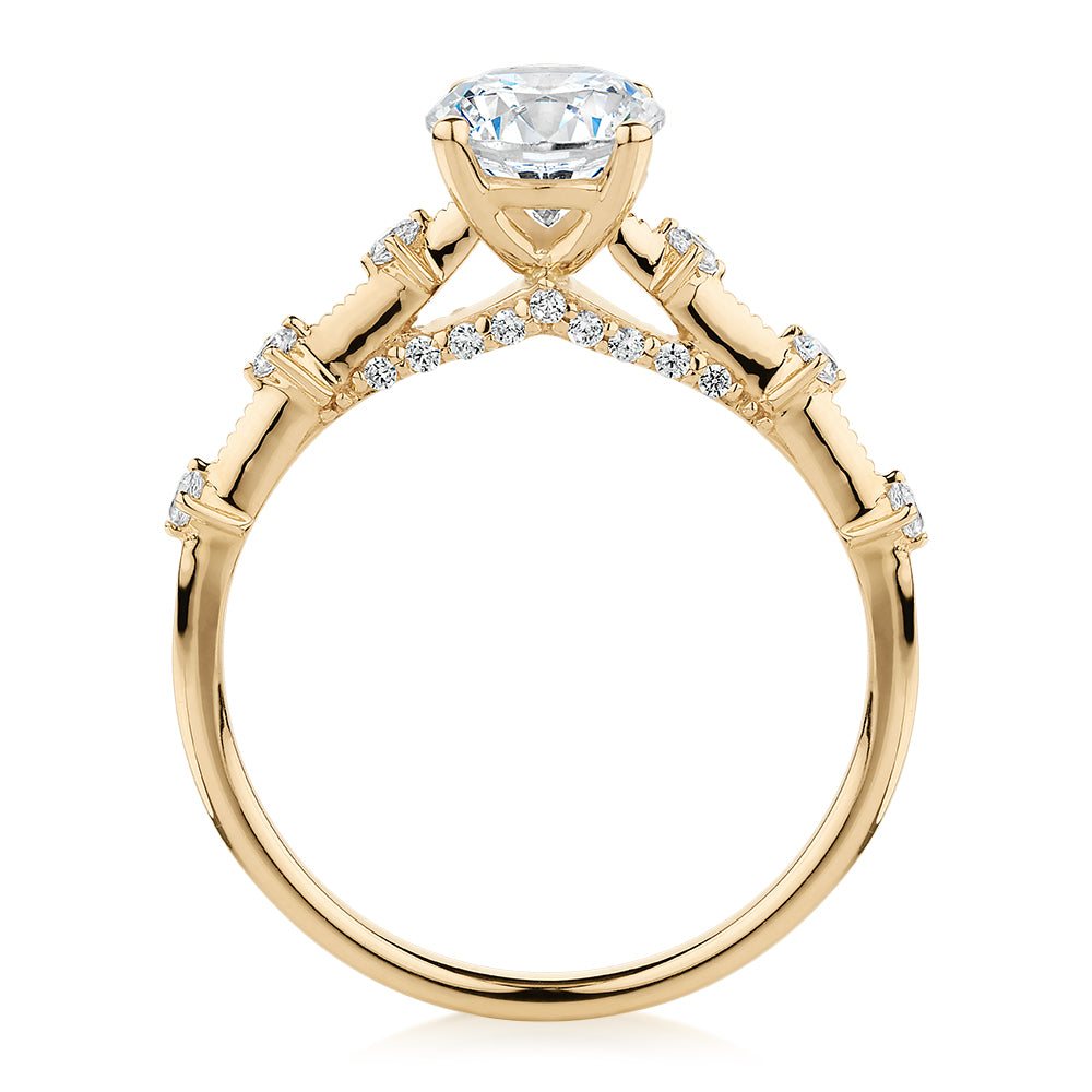 Round Brilliant shouldered engagement ring with 1.20 carats* of diamond simulants in 14 carat yellow gold