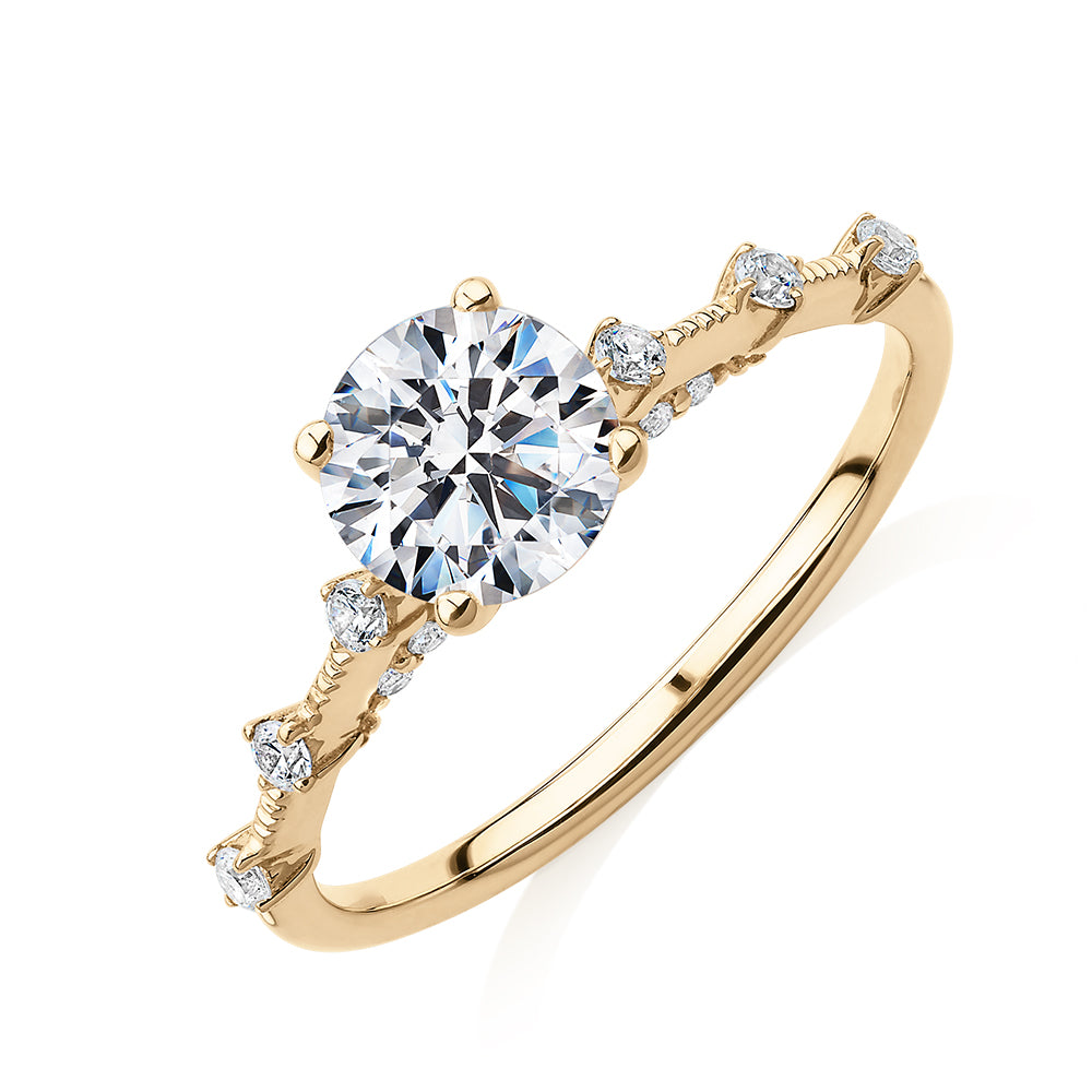 Round Brilliant shouldered engagement ring with 1.20 carats* of diamond simulants in 14 carat yellow gold