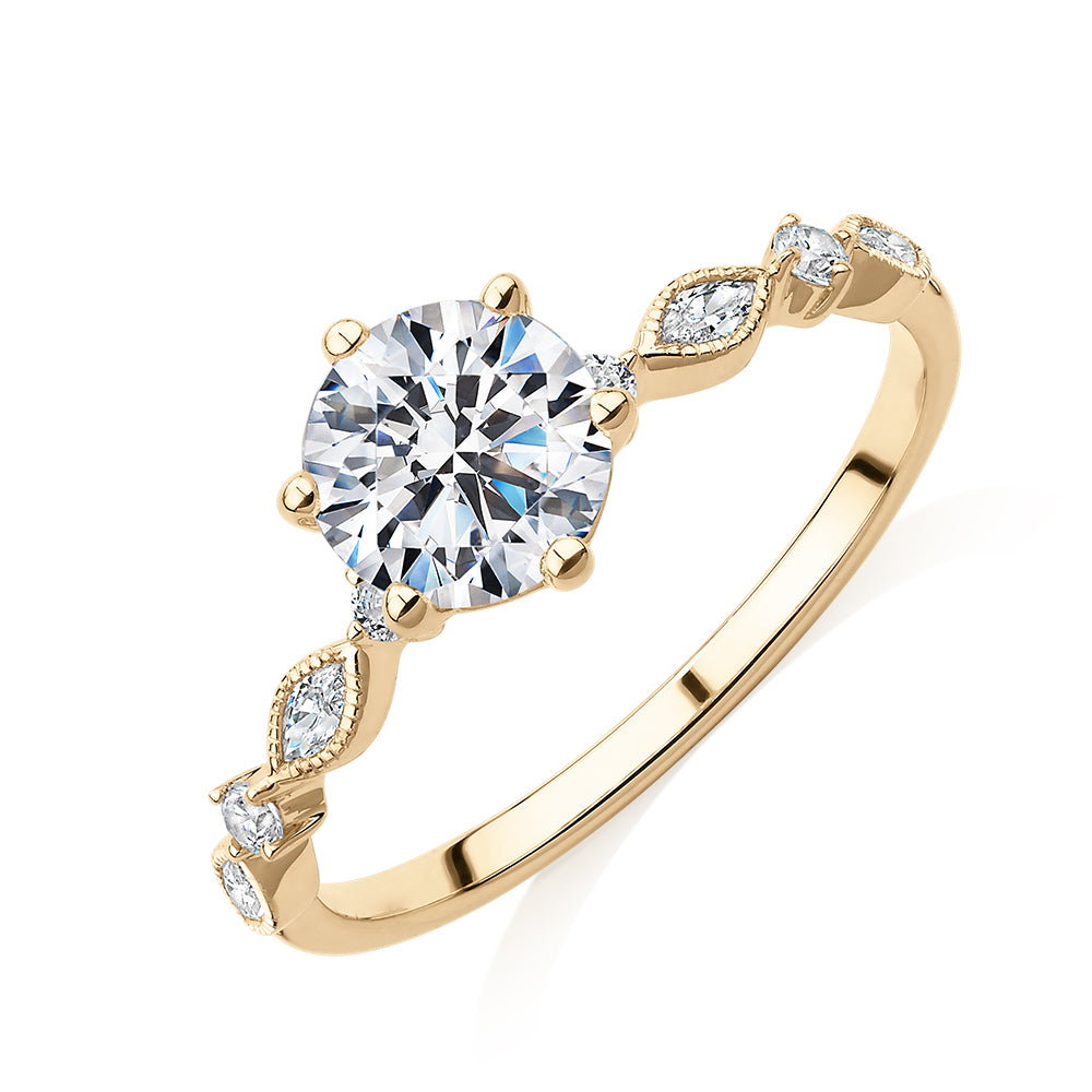 Round Brilliant shouldered engagement ring with 1.19 carats* of diamond simulants in 14 carat yellow gold