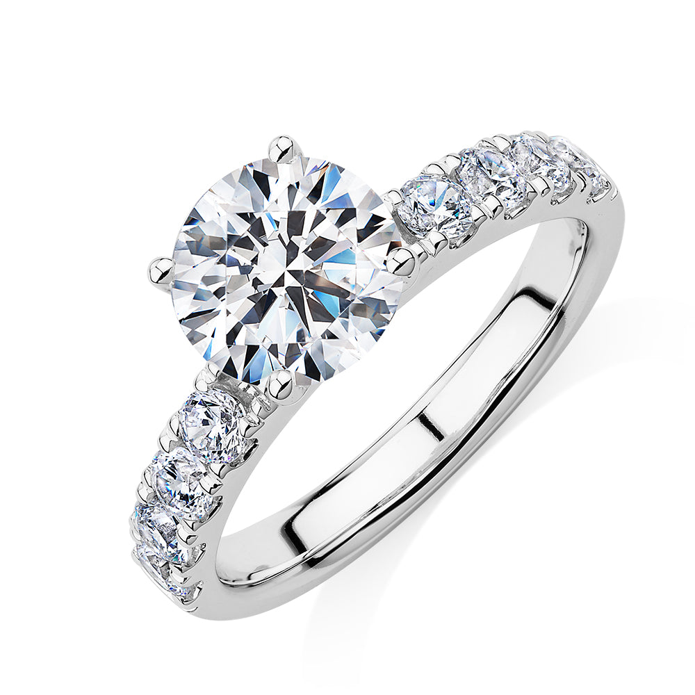 Round Brilliant shouldered engagement ring with 2.68 carats* of diamond simulants in 14 carat white gold