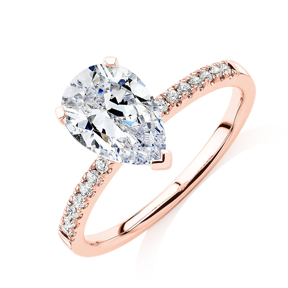 Pear and Round Brilliant shouldered engagement ring with 1.88 carats* of diamond simulants in 14 carat rose gold