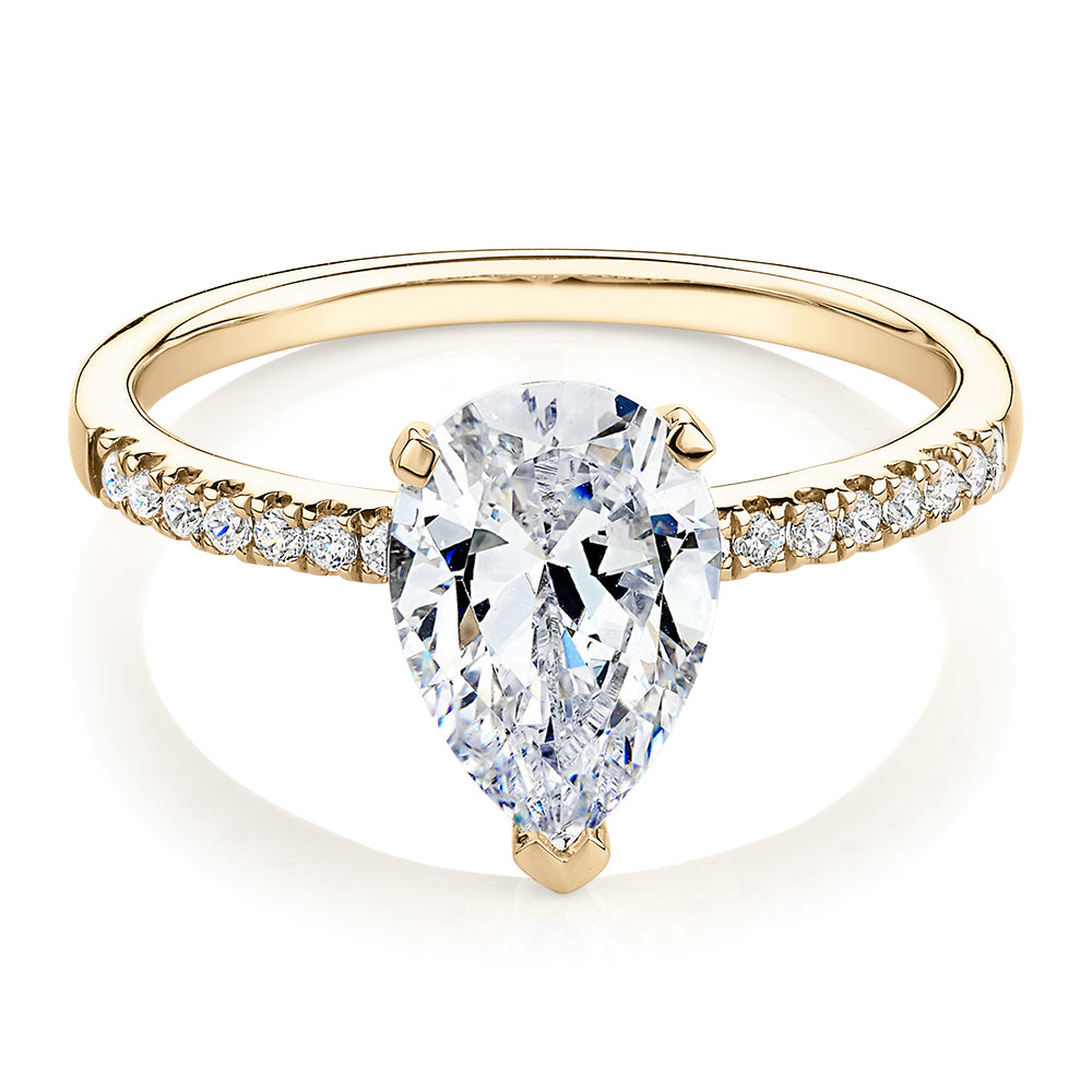 Pear and Round Brilliant shouldered engagement ring with 1.88 carats* of diamond simulants in 14 carat yellow gold