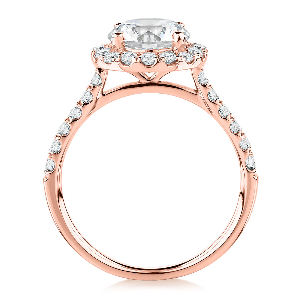 Round Brilliant halo engagement ring with 2.46 carats* of diamond simulants in 10 carat rose gold