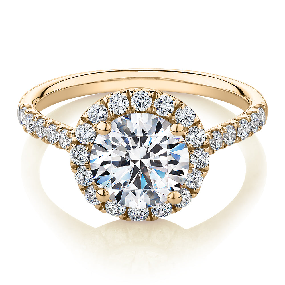 Round Brilliant halo engagement ring with 2.46 carats* of diamond simulants in 10 carat yellow gold
