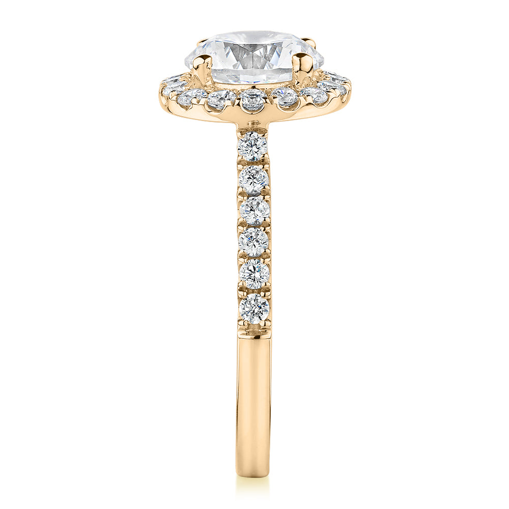 Round Brilliant halo engagement ring with 2.46 carats* of diamond simulants in 10 carat yellow gold
