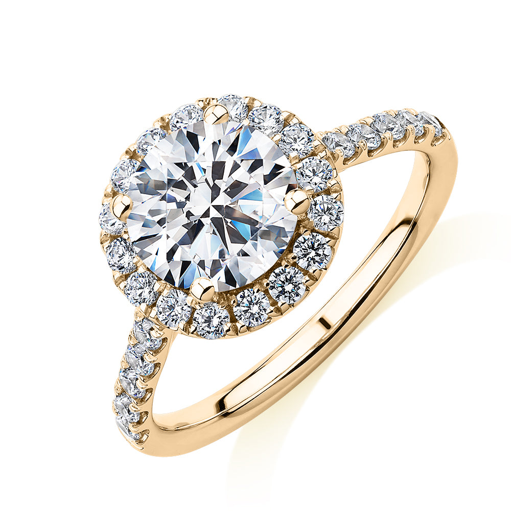 Round Brilliant halo engagement ring with 2.46 carats* of diamond simulants in 10 carat yellow gold