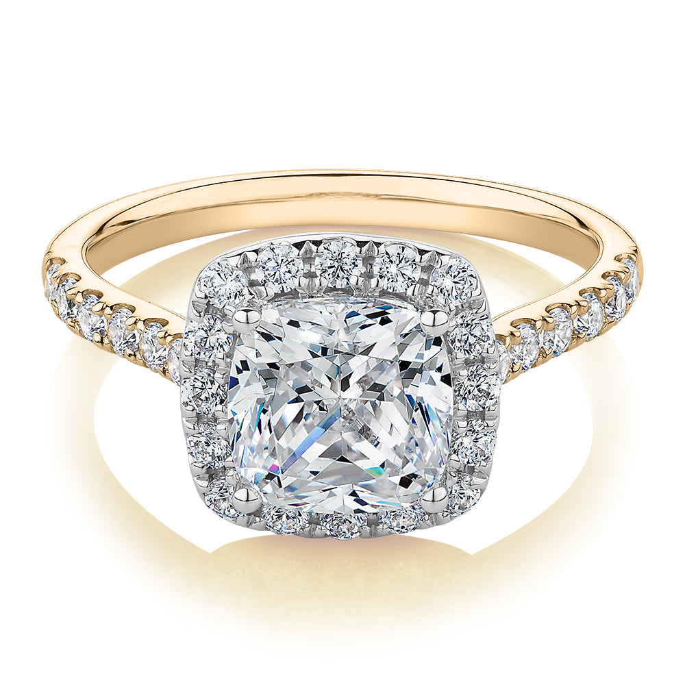 Cushion and Round Brilliant halo engagement ring with 2.09 carats* of diamond simulants in 10 carat yellow and white gold