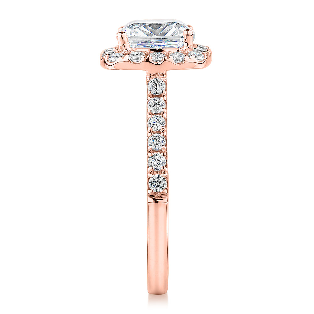 Cushion and Round Brilliant halo engagement ring with 2.09 carats* of diamond simulants in 10 carat rose gold