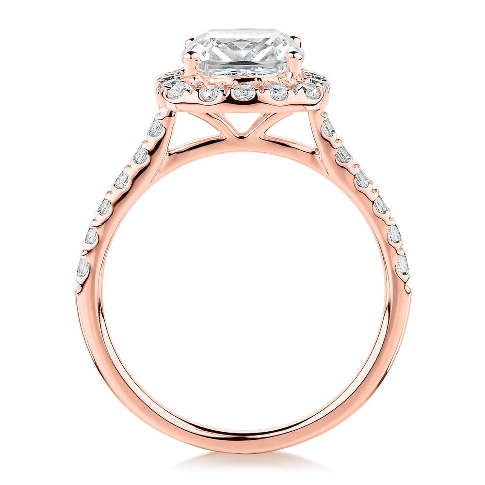 Cushion and Round Brilliant halo engagement ring with 2.09 carats* of diamond simulants in 10 carat rose gold