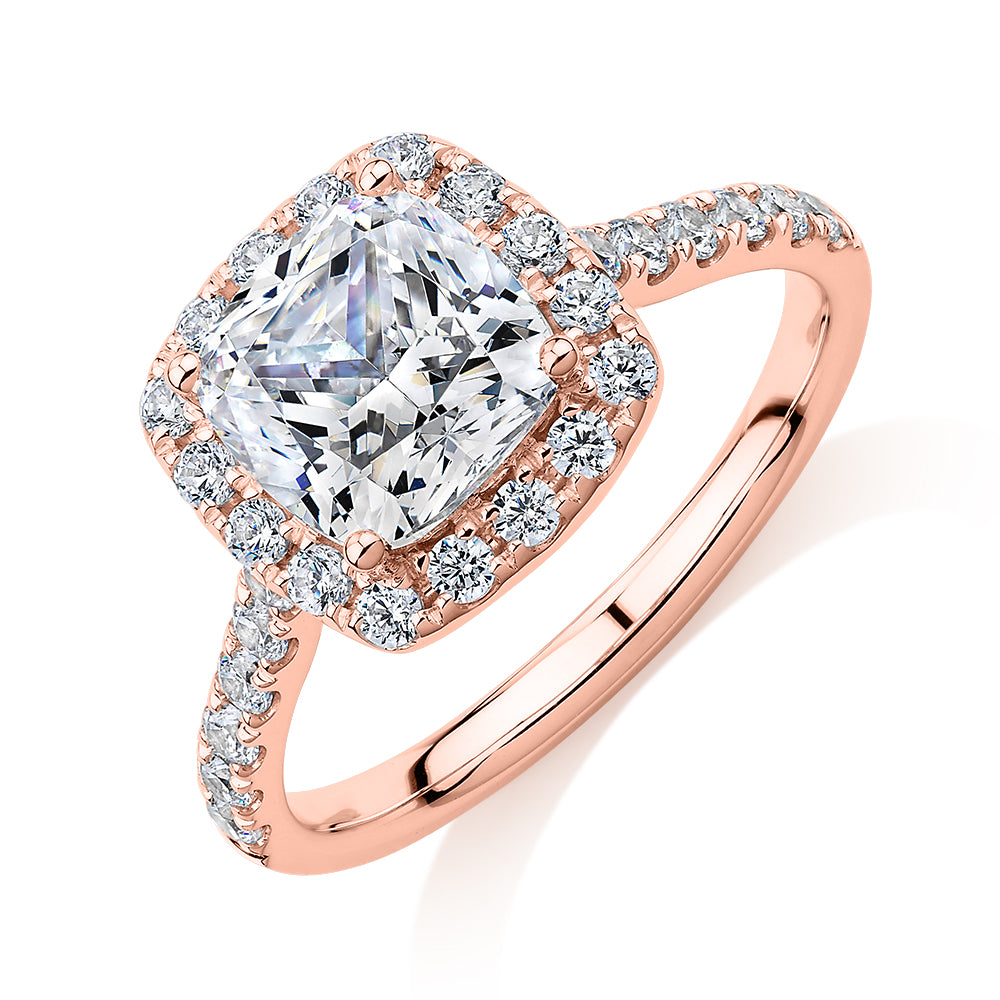 Cushion and Round Brilliant halo engagement ring with 2.09 carats* of diamond simulants in 10 carat rose gold