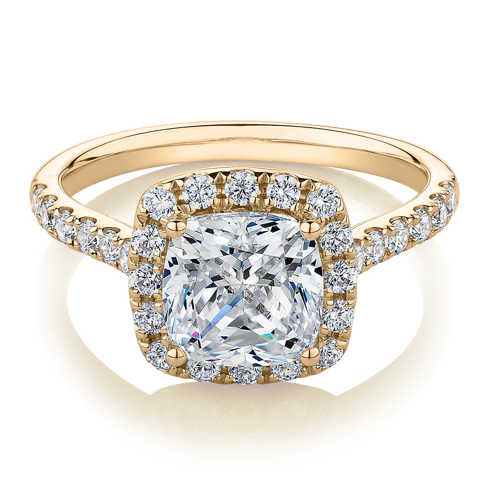 Cushion and Round Brilliant halo engagement ring with 2.09 carats* of diamond simulants in 10 carat yellow gold