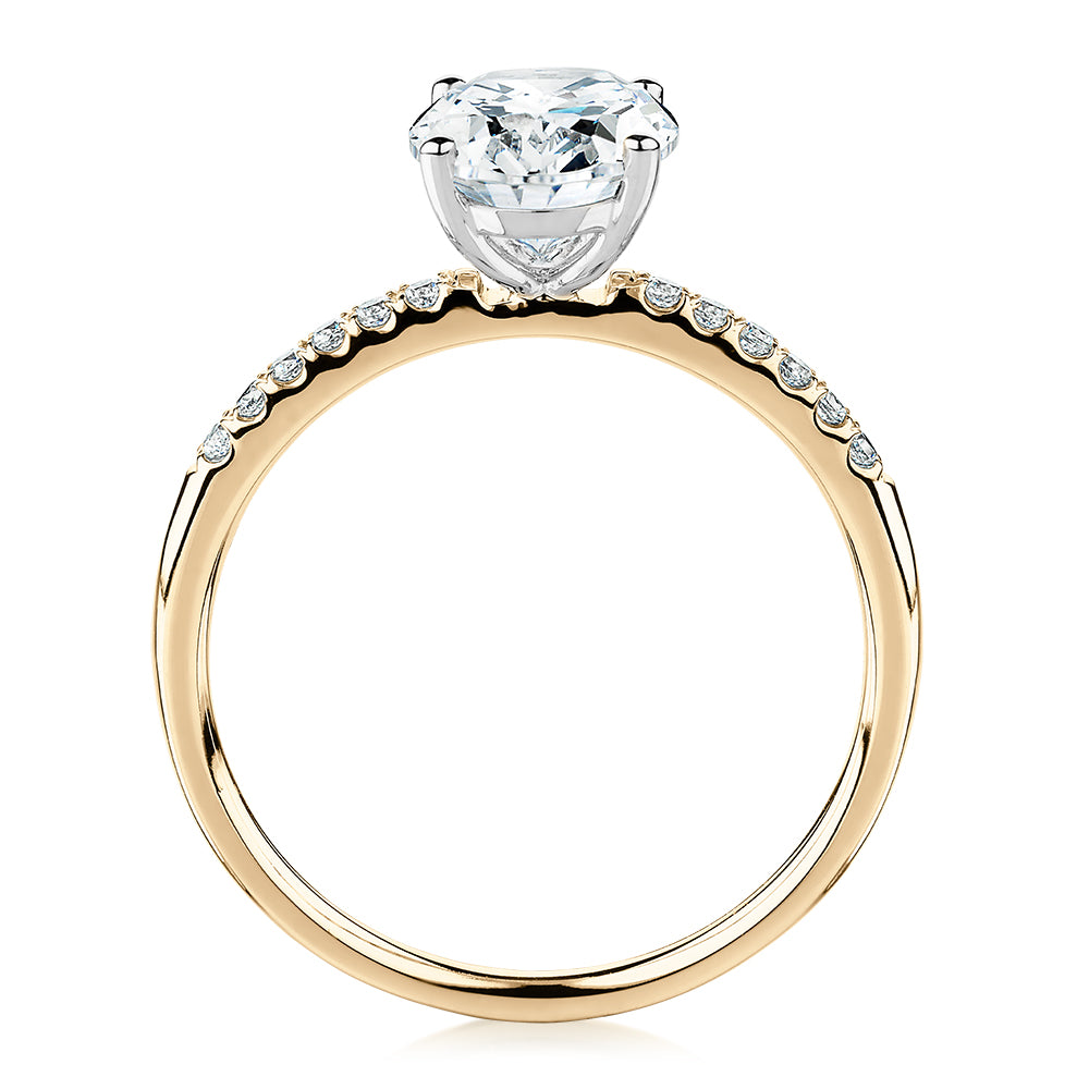 Oval and Round Brilliant shouldered engagement ring with 1.94 carats* of diamond simulants in 14 carat yellow and white gold