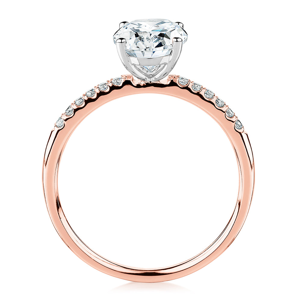 Oval and Round Brilliant shouldered engagement ring with 1.94 carats* of diamond simulants in 14 carat rose and white gold