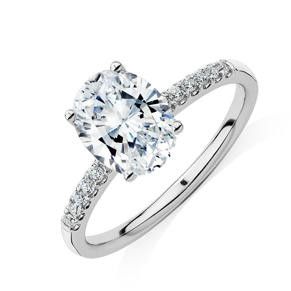 Oval and Round Brilliant shouldered engagement ring with 1.94 carats* of diamond simulants in 14 carat white gold