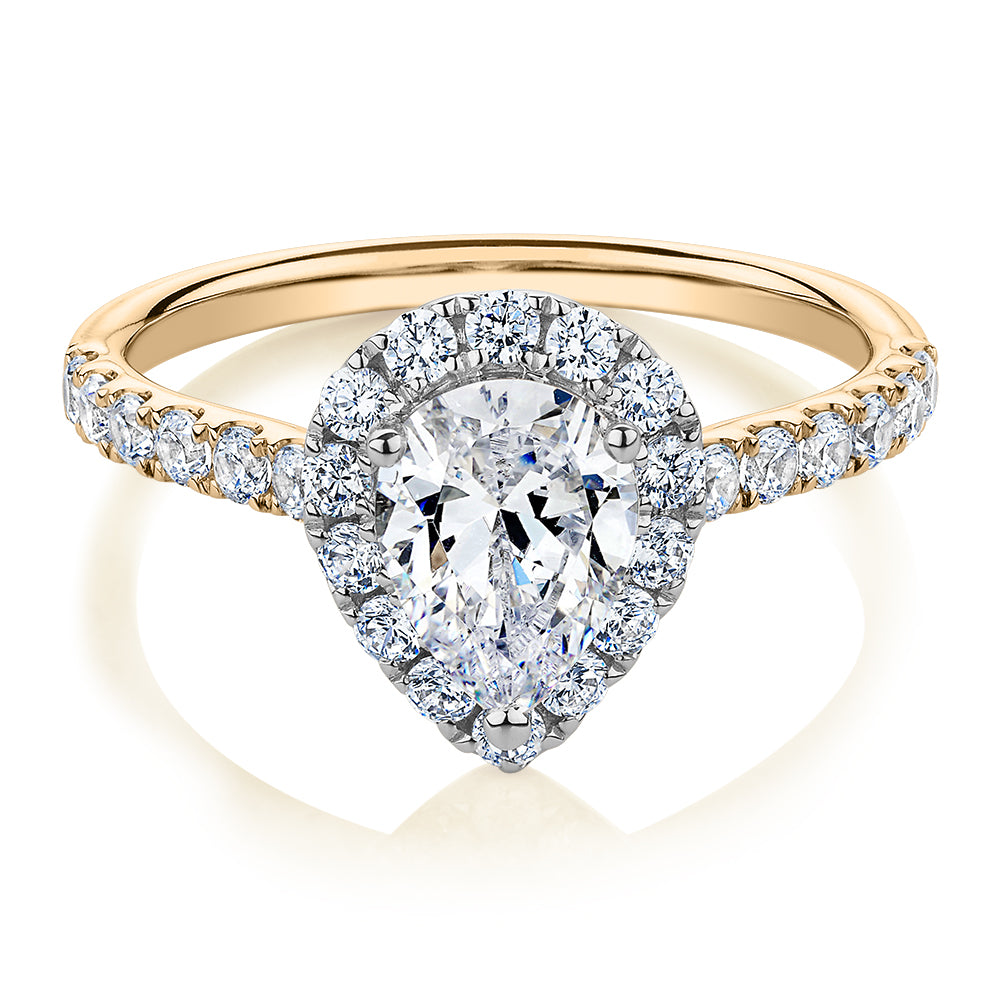 Pear and Round Brilliant halo engagement ring with 1.83 carats* of diamond simulants in 14 carat yellow and white gold