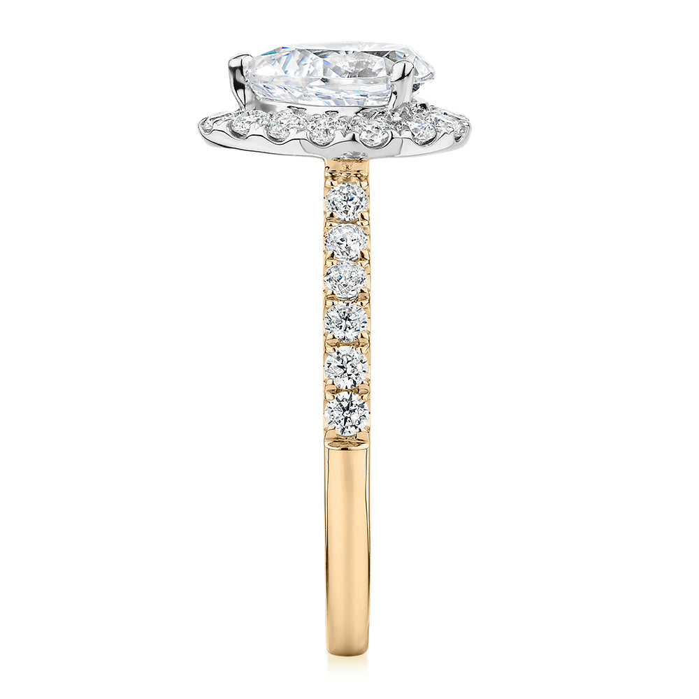 Pear and Round Brilliant halo engagement ring with 1.83 carats* of diamond simulants in 14 carat yellow and white gold