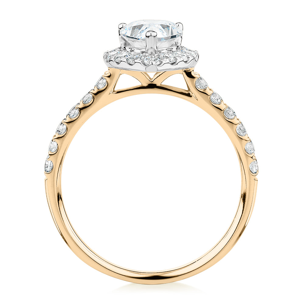 Pear and Round Brilliant halo engagement ring with 1.83 carats* of diamond simulants in 14 carat yellow and white gold