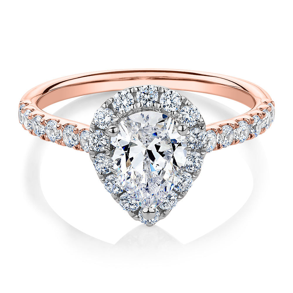 Pear and Round Brilliant halo engagement ring with 1.83 carats* of diamond simulants in 14 carat rose and white gold