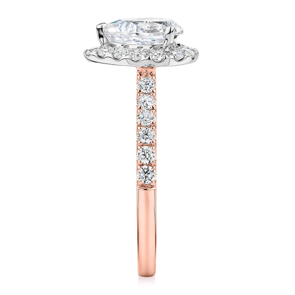 Pear and Round Brilliant halo engagement ring with 1.83 carats* of diamond simulants in 14 carat rose and white gold