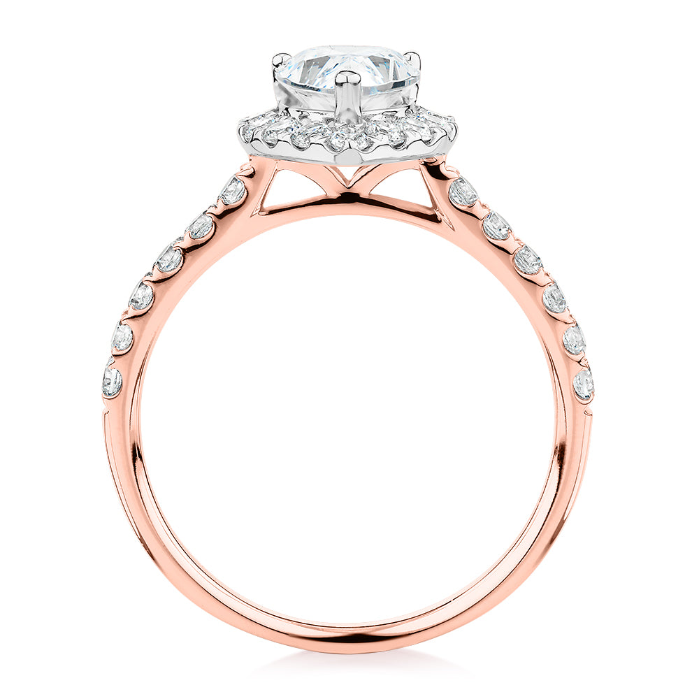 Pear and Round Brilliant halo engagement ring with 1.83 carats* of diamond simulants in 14 carat rose and white gold