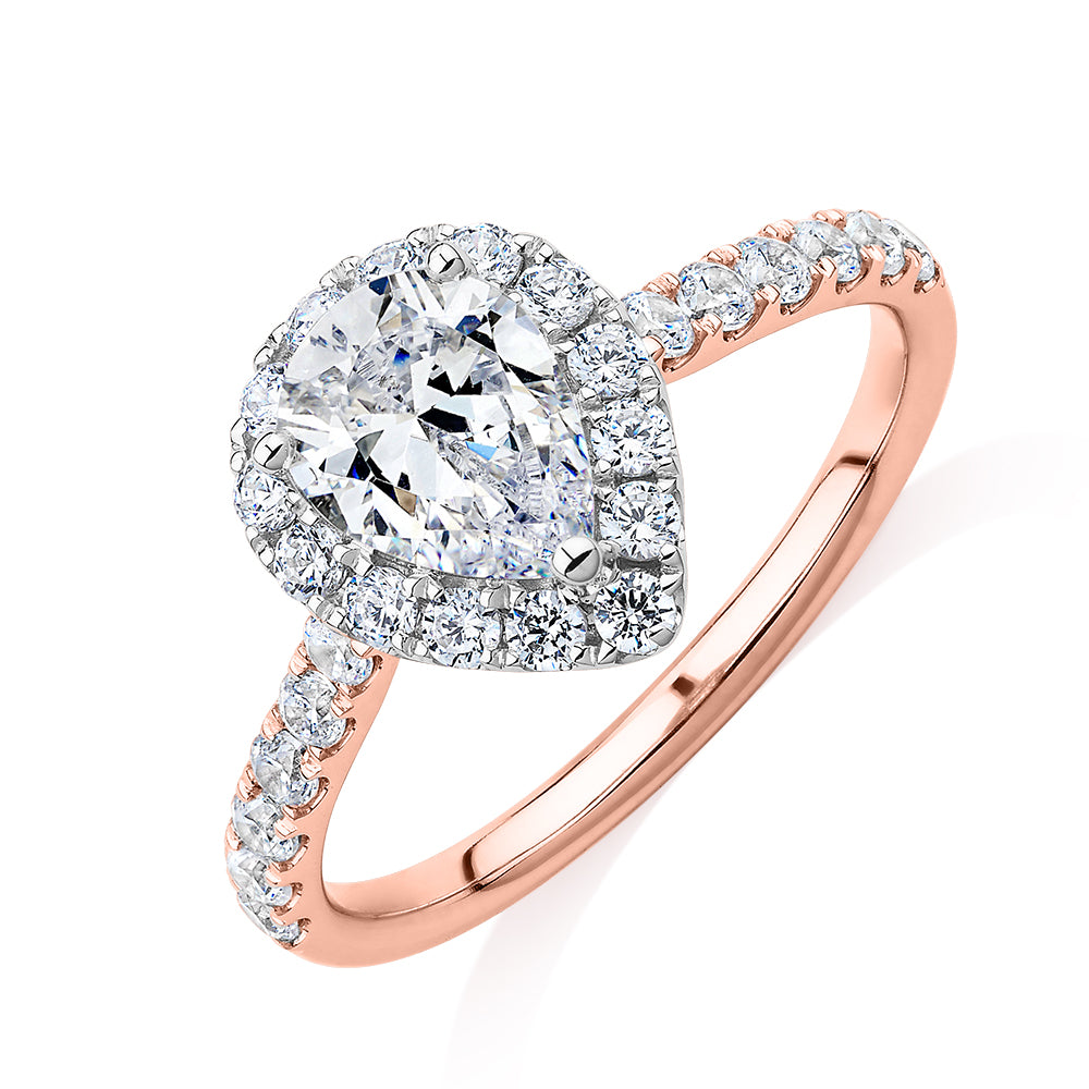 Pear and Round Brilliant halo engagement ring with 1.83 carats* of diamond simulants in 14 carat rose and white gold