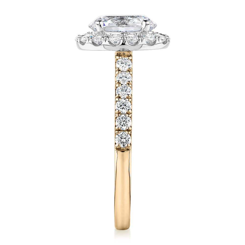 Oval and Round Brilliant halo engagement ring with 1.79 carats* of diamond simulants in 14 carat yellow and white gold