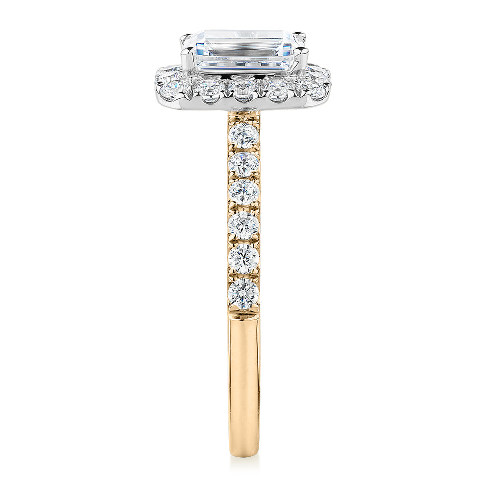 Emerald Cut and Round Brilliant halo engagement ring with 1.65 carats* of diamond simulants in 14 carat yellow and white gold