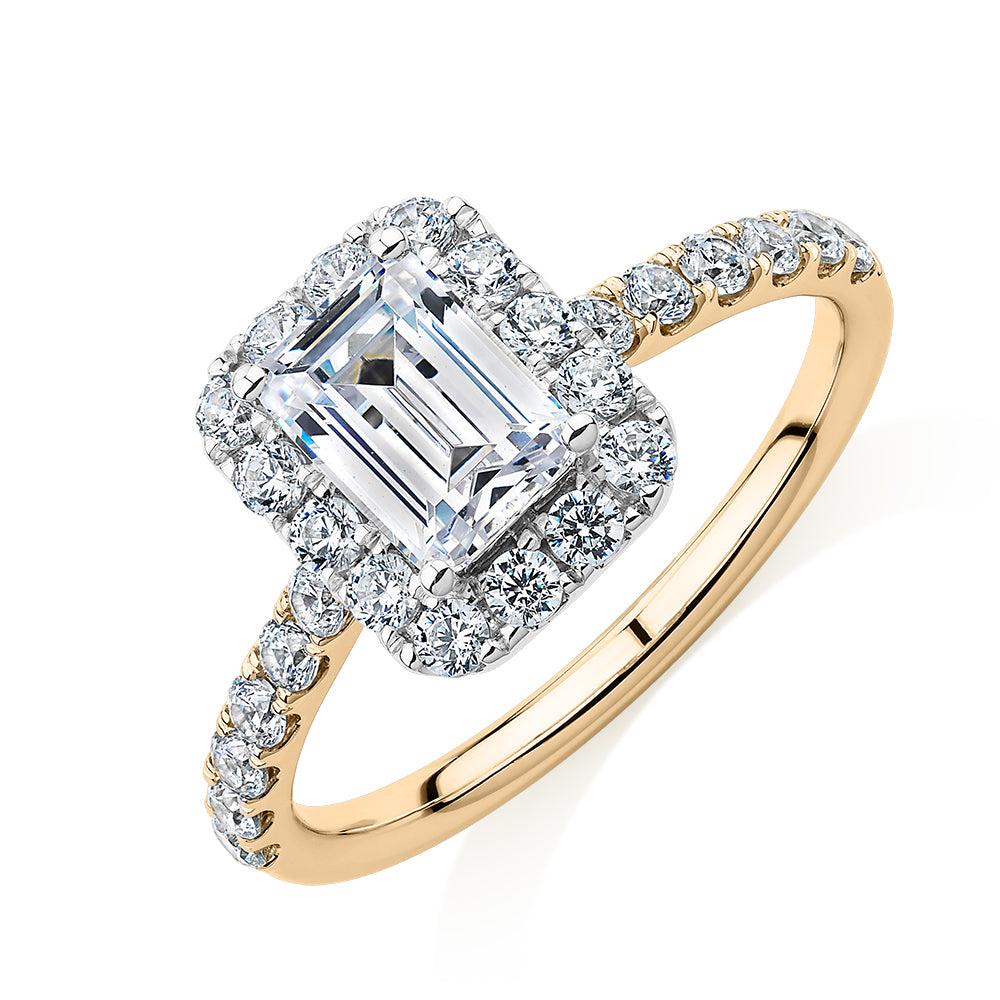 Emerald Cut and Round Brilliant halo engagement ring with 1.65 carats* of diamond simulants in 14 carat yellow and white gold