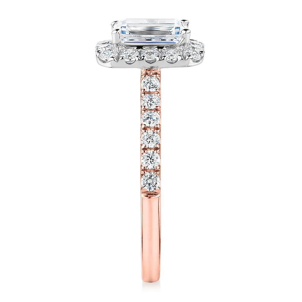 Emerald Cut and Round Brilliant halo engagement ring with 1.65 carats* of diamond simulants in 14 carat rose and white gold