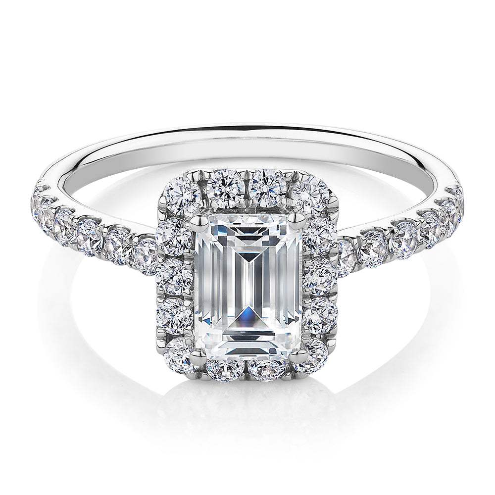 Emerald Cut and Round Brilliant halo engagement ring with 1.65 carats* of diamond simulants in 14 carat white gold