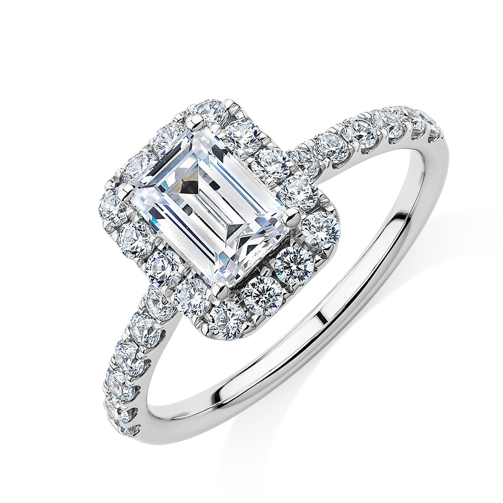 Emerald Cut and Round Brilliant halo engagement ring with 1.65 carats* of diamond simulants in 14 carat white gold
