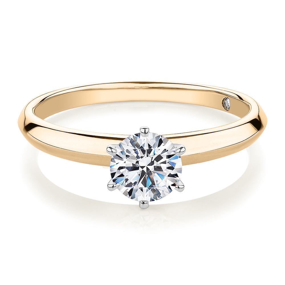 Round Brilliant solitaire engagement ring with 0.70 carat* diamond simulant in 14 carat yellow and white gold
