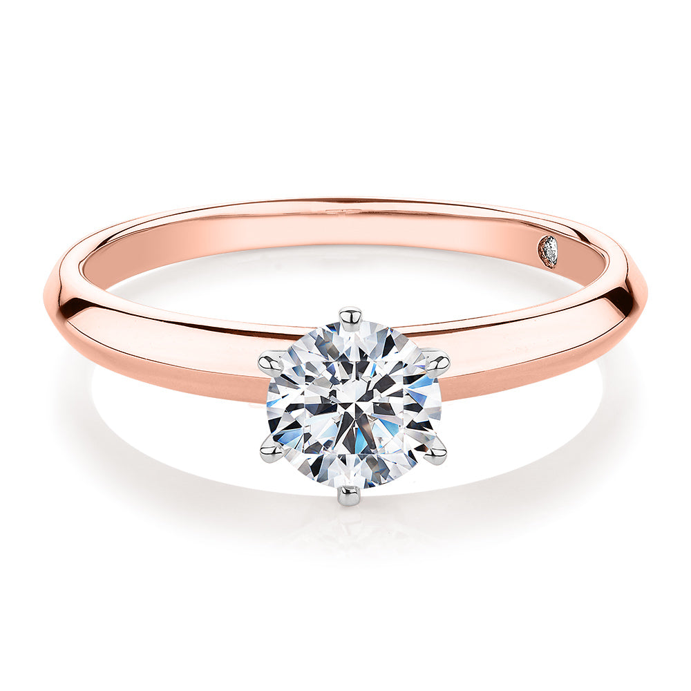 Round Brilliant solitaire engagement ring with 0.70 carat* diamond simulant in 14 carat rose and white gold