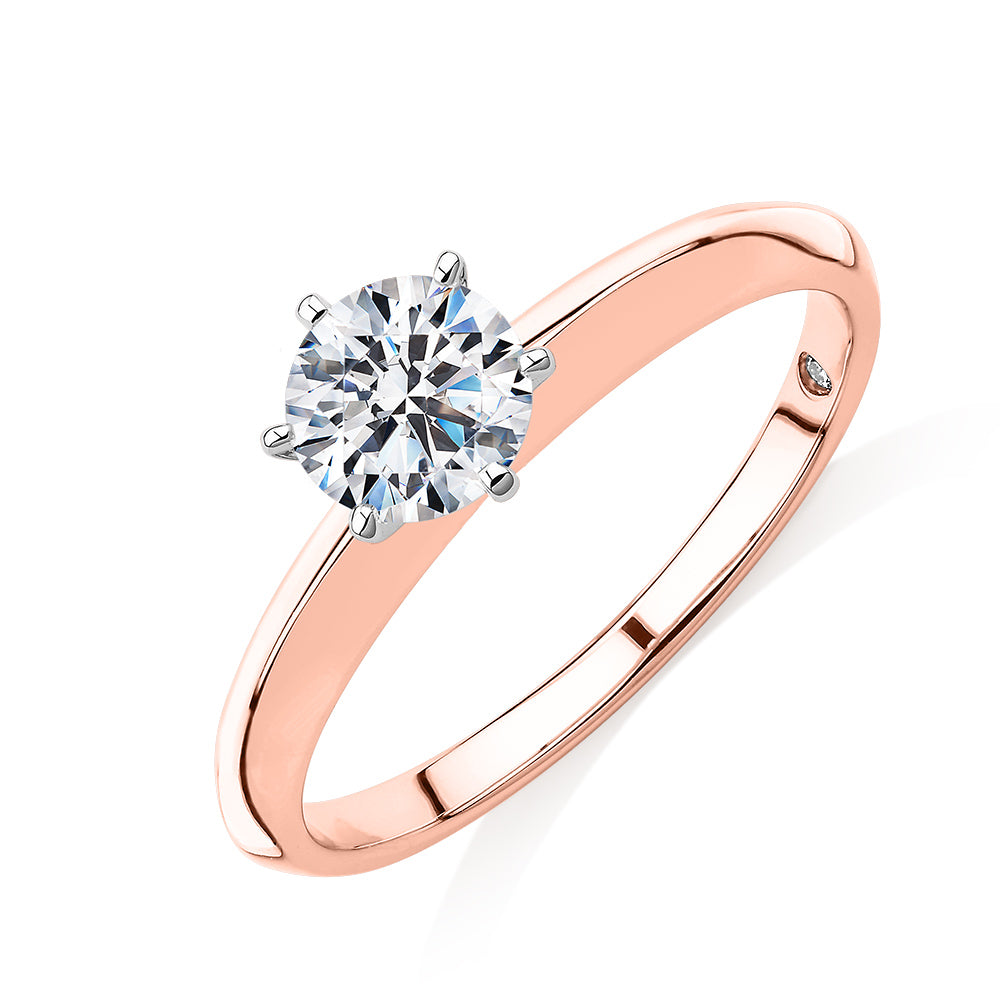 Round Brilliant solitaire engagement ring with 0.70 carat* diamond simulant in 14 carat rose and white gold
