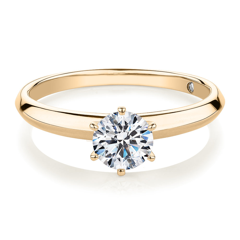 Round Brilliant solitaire engagement ring with 0.70 carat* diamond simulant in 14 carat yellow gold