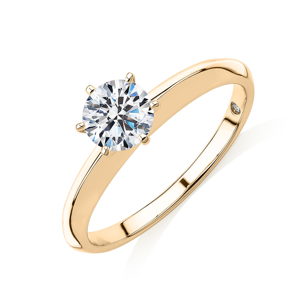 Round Brilliant solitaire engagement ring with 0.70 carat* diamond simulant in 14 carat yellow gold