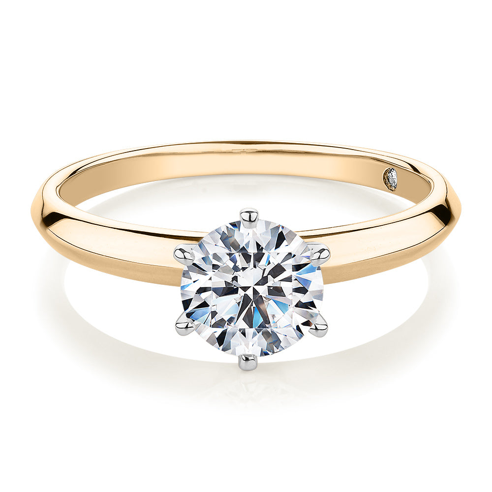 Round Brilliant solitaire engagement ring with 1 carat* diamond simulant in 14 carat yellow and white gold
