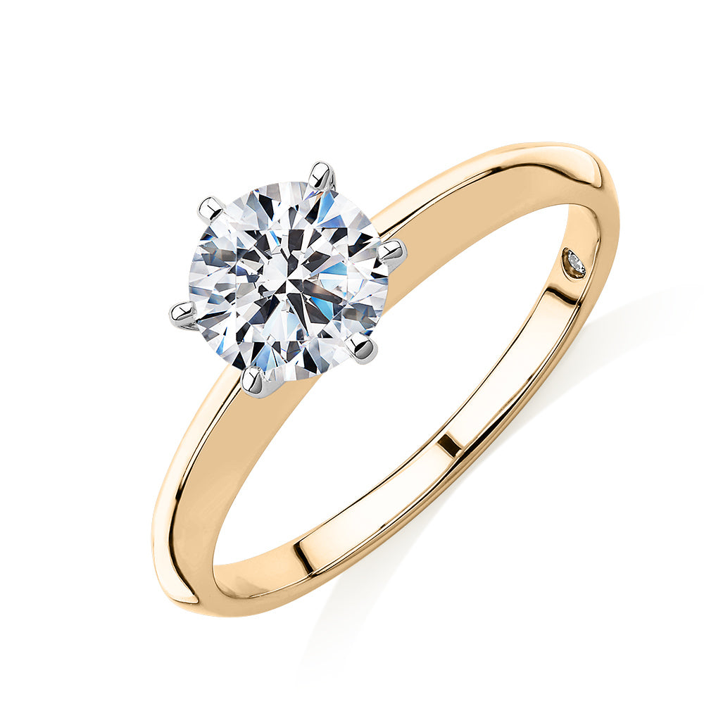 Round Brilliant solitaire engagement ring with 1 carat* diamond simulant in 14 carat yellow and white gold