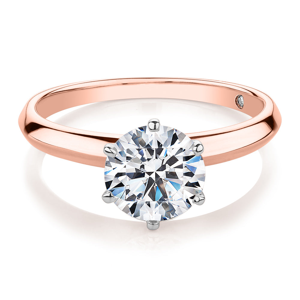 Round Brilliant solitaire engagement ring with 1.5 carat* diamond simulant in 14 carat rose and white gold