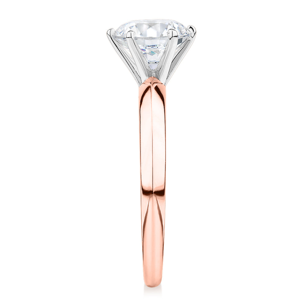 Round Brilliant solitaire engagement ring with 1.5 carat* diamond simulant in 14 carat rose and white gold