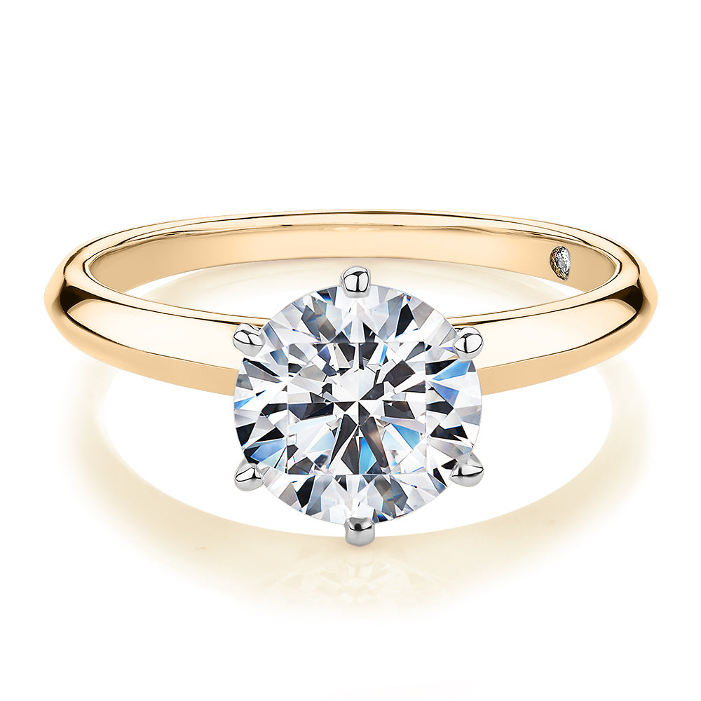 Round Brilliant solitaire engagement ring with 2 carat* diamond simulant in 14 carat yellow and white gold