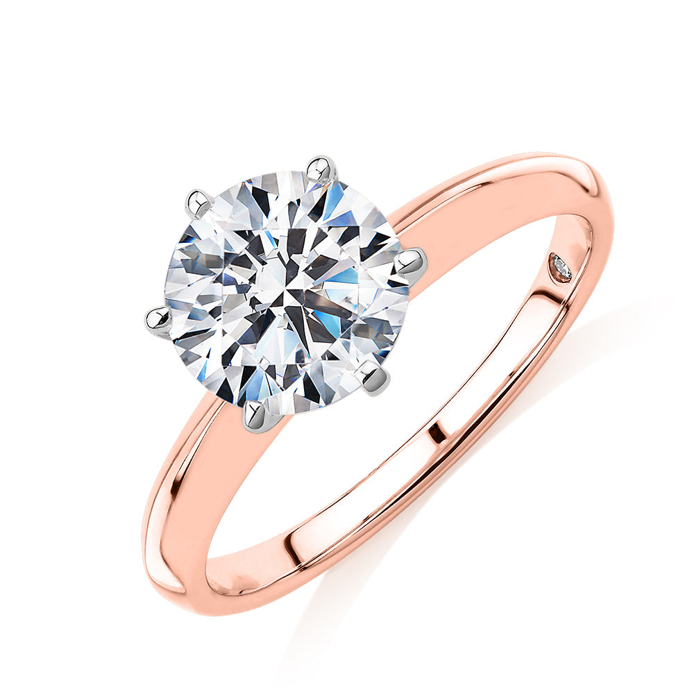 Round Brilliant solitaire engagement ring with 2 carat* diamond simulant in 14 carat rose and white gold