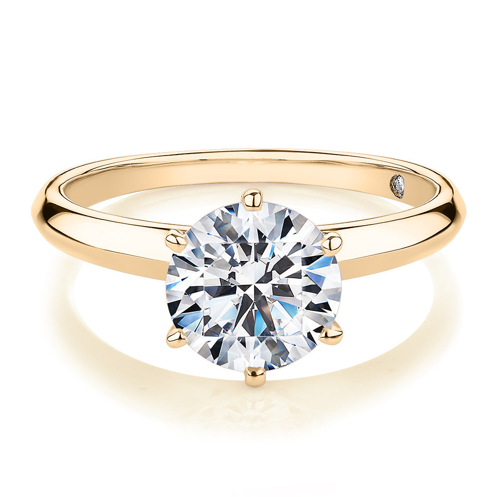 Round Brilliant solitaire engagement ring with 2 carat* diamond simulant in 14 carat yellow gold