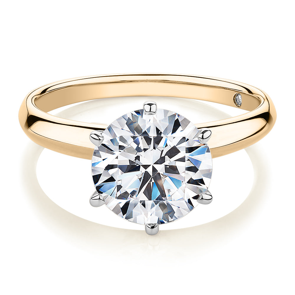 Round Brilliant solitaire engagement ring with 3 carat* diamond simulant in 14 carat yellow and white gold