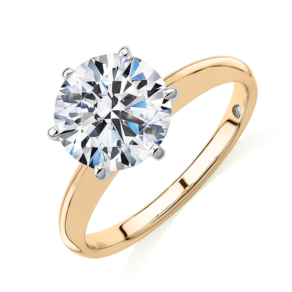 Round Brilliant solitaire engagement ring with 3 carat* diamond simulant in 14 carat yellow and white gold