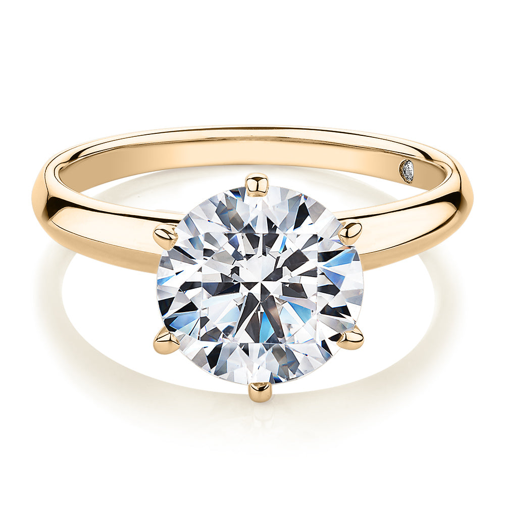 Round Brilliant solitaire engagement ring with 3 carat* diamond simulant in 14 carat yellow gold