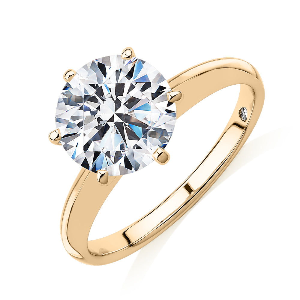 Round Brilliant solitaire engagement ring with 3 carat* diamond simulant in 14 carat yellow gold