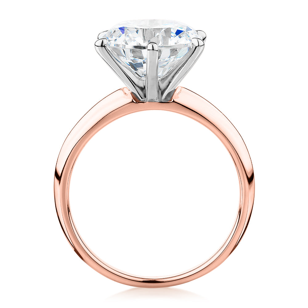 Round Brilliant solitaire engagement ring with 4 carat* diamond simulant in 14 carat rose and white gold